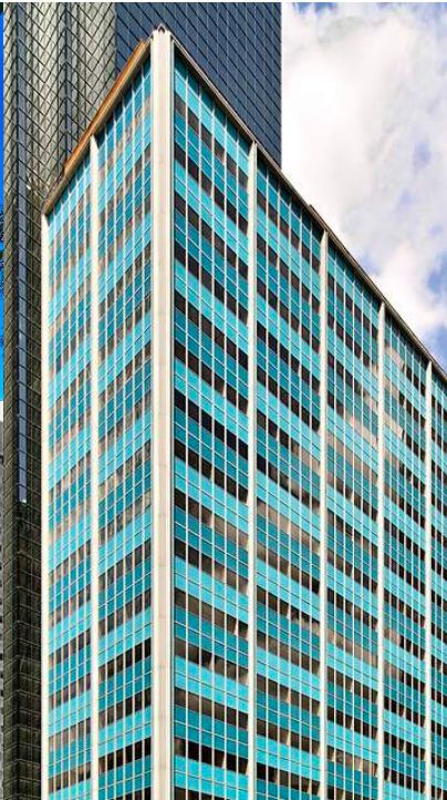 The 211 North Ervay tower in downtown Dallas with its distinctive blue and teal mid-century facade